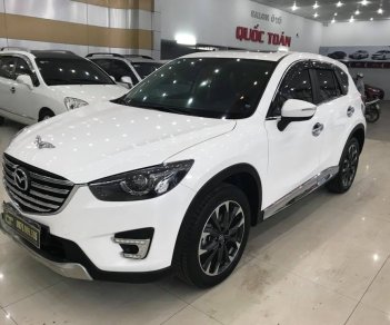 Mazda CX 5 2.0AT 2016 - Cần bán gấp Mazda CX 5 2.0AT sản xuất năm 2016, màu trắng số tự động