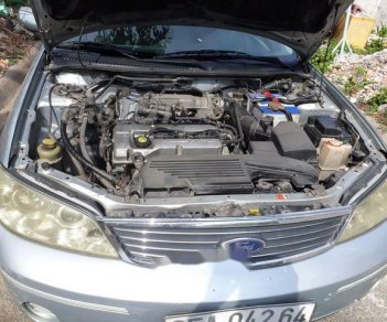 Ford Laser   2004 - Cần bán Ford Laser sản xuất năm 2004, màu bạc xe gia đình, giá 185tr