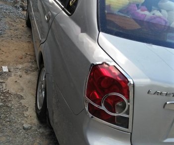 Daewoo Lacetti EX 1.6 MT 2005 - Cần bán gấp Daewoo Lacetti EX 1.6 MT năm sản xuất 2005, màu bạc