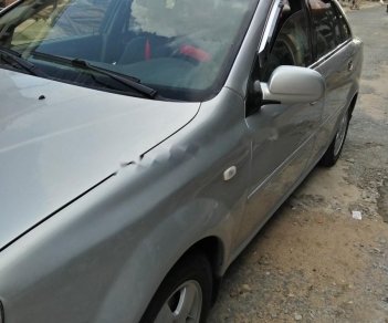 Daewoo Lacetti EX 1.6 MT 2005 - Cần bán gấp Daewoo Lacetti EX 1.6 MT năm sản xuất 2005, màu bạc