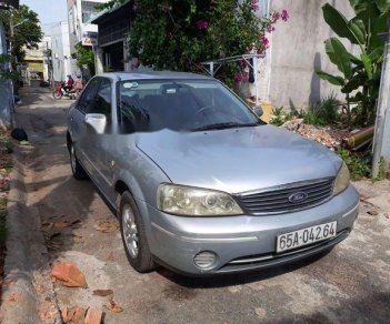 Ford Laser   2004 - Cần bán Ford Laser sản xuất năm 2004, màu bạc xe gia đình, giá 185tr