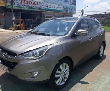 Hyundai Tucson 2.0 AT 4WD 2011 - Cần bán gấp Hyundai Tucson 2.0 AT 4WD 2011, màu nâu, xe nhập, 539 triệu