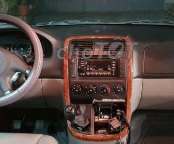 Kia Carnival 2005 - Cần bán Kia Carnival năm sản xuất 2005, màu đen xe gia đình, giá chỉ 340 triệu