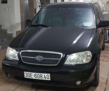 Kia Carnival 2005 - Cần bán Kia Carnival năm sản xuất 2005, màu đen xe gia đình, giá chỉ 340 triệu