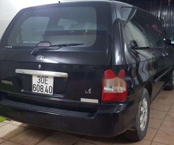 Kia Carnival 2005 - Cần bán Kia Carnival năm sản xuất 2005, màu đen xe gia đình, giá chỉ 340 triệu