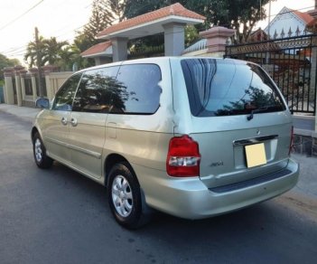 Kia Carnival GS 2.5 AT 2009 - Bán Kia Carnival GS 2.5 AT năm sản xuất 2009, màu vàng cát