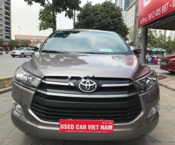 Toyota Innova 2.0E 2016 - Cần bán gấp Toyota Innova 2.0E năm 2016, màu nâu, 699 triệu