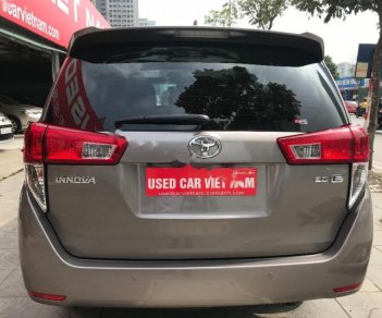 Toyota Innova 2.0E 2016 - Cần bán gấp Toyota Innova 2.0E năm 2016, màu nâu, 699 triệu