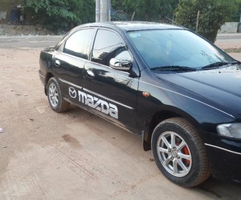 Mazda 323 2000 - Cần bán Mazda 323 sản xuất năm 2000, màu đen, nhập khẩu nguyên chiếc, giá cạnh tranh