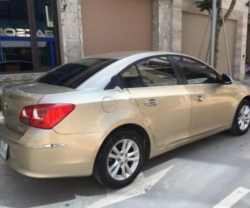 Chevrolet Cruze LT 1.6 MT 2015 - Bán xe Chevrolet Cruze LT 1.6 MT sản xuất năm 2015, màu vàng cát