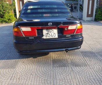 Mazda 323 1999 - Bán xe Mazda 323 sản xuất năm 1999, màu đen, nhập khẩu nguyên chiếc, 99tr