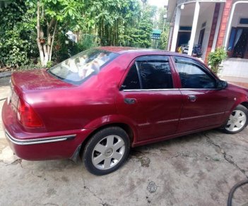 Ford Laser Ghia 1.8 MT 2003 - Chính chủ bán ô tô Ford Laser Ghia 1.8 MT 2003, màu đỏ