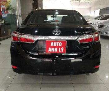 Toyota Corolla altis 1.8MT 2015 - Bán ô tô Toyota Corolla altis 1.8MT đời 2015, màu đen, 610 triệu