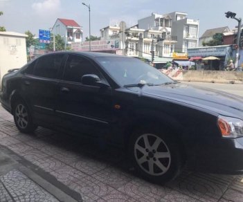 Daewoo Magnus 2.0 2004 - Bán Daewoo Magnus 2.0 năm sản xuất 2004, màu đen số sàn, 140 triệu