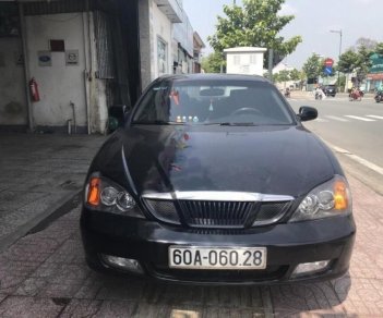 Daewoo Magnus 2.0 2004 - Bán Daewoo Magnus 2.0 năm sản xuất 2004, màu đen số sàn, 140 triệu