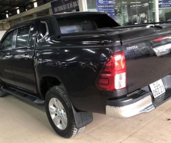 Toyota Hilux 3.0G 4x4 AT 2016 - Bán ô tô Toyota Hilux XLS AT sản xuất năm 2016, màu đen