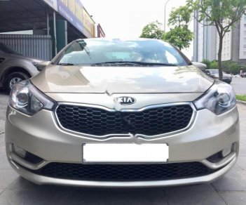 Kia K3 2014 - Cần bán gấp Kia K3 năm sản xuất 2014, màu vàng