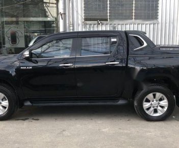 Toyota Hilux   3.0G 4X4 2015 - Cần bán gấp Toyota Hilux 3.0G 4X4 đời 2015, màu đen số tự động, 708 triệu