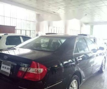 Toyota Camry 2002 - Cần bán lại xe Toyota Camry đời 2002, màu đen xe gia đình, 310 triệu