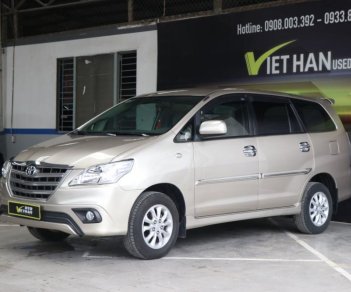 Toyota Innova E 2.0MT 2014 - Cần bán xe Toyota Innova E 2.0MT sản xuất 2014, màu vàng