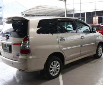 Toyota Innova 2.0E 2014 - Cần bán lại xe Toyota Innova E 2.0MT sản xuất 2014, màu vàng