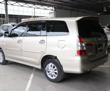 Toyota Innova 2.0E 2014 - Cần bán lại xe Toyota Innova E 2.0MT sản xuất 2014, màu vàng