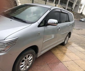 Toyota Innova 2014 - Cần bán gấp Toyota Innova sản xuất năm 2014, màu bạc chính chủ