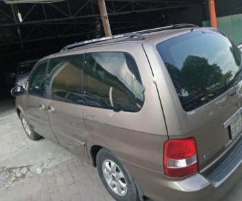 Kia Carnival 2009 - Cần bán Kia Carnival đời 2009, màu vàng