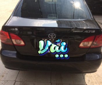 Toyota Corolla altis 1.8G MT 2004 - Bán Toyota Corolla altis 1.8G MT 2004, màu đen số sàn, 295tr