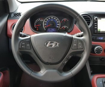 Hyundai Grand i10  1.2 AT 2016 - Cần bán lại xe Hyundai Grand i10 1.2 AT đời 2016, màu trắng, xe nhập