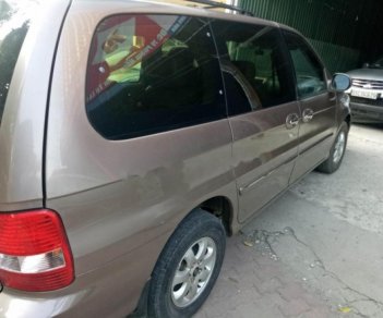 Kia Carnival 2009 - Cần bán Kia Carnival đời 2009, màu vàng