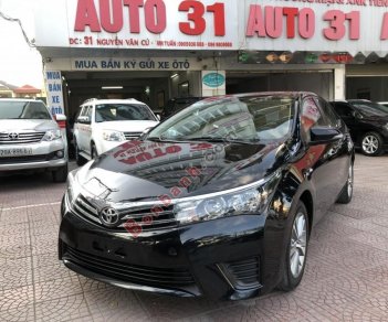 Toyota Corolla altis 1.8G MT 2014 - Cần bán xe Toyota Corolla Altis 1.8G MT sản xuất năm 2014, màu đen giá cạnh tranh