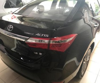 Toyota Corolla altis 1.8 G 2014 - Cần bán lại xe Toyota Corolla Altis 1.8 G 2014, màu đen chính chủ, giá 605tr