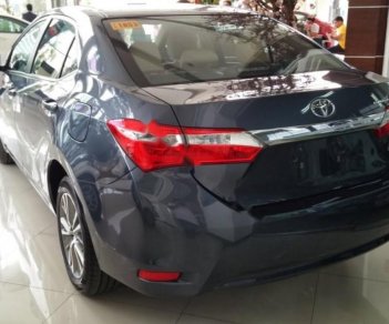 Toyota Corolla altis 1.8 2014 - Bán xe Toyota Corolla altis 1.8 đời 2014, màu xanh lam số tự động giá cạnh tranh