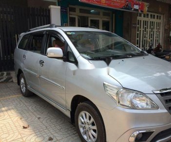 Toyota Innova  E 2014 - Cần bán gấp Toyota Innova E sản xuất 2014, màu bạc ít sử dụng