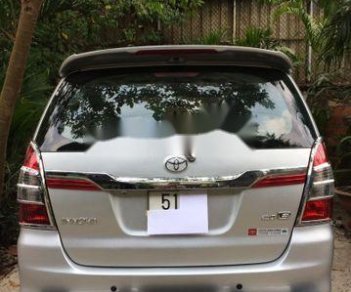 Toyota Innova  E 2014 - Cần bán gấp Toyota Innova E sản xuất 2014, màu bạc ít sử dụng