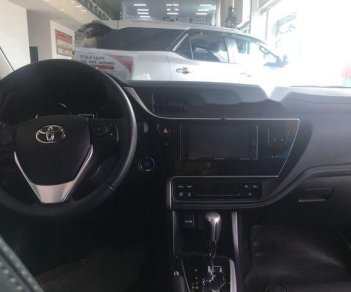 Toyota Corolla altis 2018 - Cần bán lại xe Toyota Corolla altis sản xuất 2018, màu trắng, giá tốt