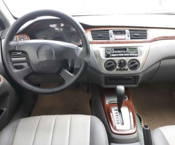 Mitsubishi Lancer    2004 - Cần bán lại xe Mitsubishi Lancer đời 2004, màu bạc