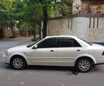 Ford Laser 1.8AT 2004 - Bán Ford Laser 1.8AT đời 2004, màu trắng chính chủ, 235 triệu