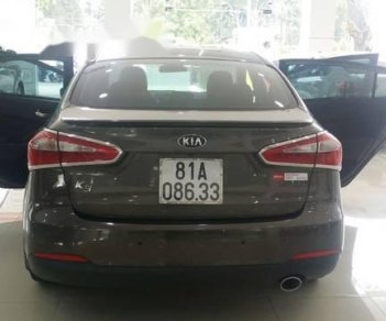 Kia K3 2014 - Cần bán gấp Kia K3 sản xuất 2014, màu nâu, giá tốt