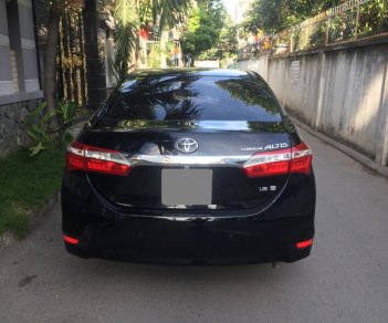 Toyota Corolla altis  G 2014 - Bán Toyota Corolla Altis G đời 2015 số sàn, màu đen