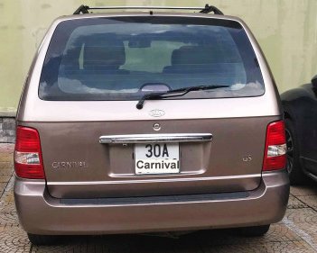 Kia Carnival   2.5 AT  2008 - Bán Kia Carnival 2.5 AT đời 2008, màu nâu