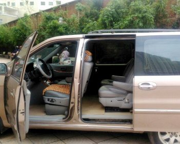 Kia Carnival   2.5 AT  2008 - Bán Kia Carnival 2.5 AT đời 2008, màu nâu