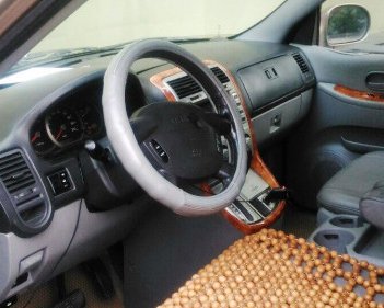 Kia Carnival   2.5 AT  2008 - Bán Kia Carnival 2.5 AT đời 2008, màu nâu