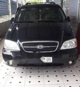 Kia Carnival 2009 - Bán ô tô Kia Carnival đời 2009, màu đen, giá 259tr