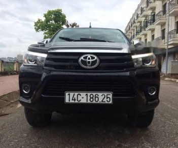 Toyota Hilux   3.0 4*4 AT 2016 - Bán ô tô Toyota Hilux 3.0 4*4 AT năm sản xuất 2016, màu đen, giá chỉ 745 triệu