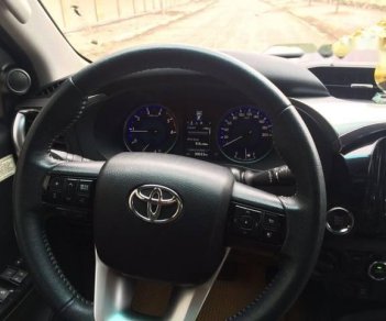 Toyota Hilux   3.0 4*4 AT 2016 - Bán ô tô Toyota Hilux 3.0 4*4 AT năm sản xuất 2016, màu đen, giá chỉ 745 triệu