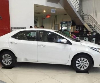Toyota Corolla altis 1.8E CVT 2018 - Bán ô tô Toyota Corolla Altis 1.8E CVT sản xuất 2018, màu trắng, giá 707tr