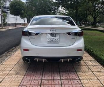 Mazda 3  1.5AT 2015 - Cần bán xe Mazda 3 1.5AT sản xuất năm 2015, màu trắng, giá chỉ 595 triệu