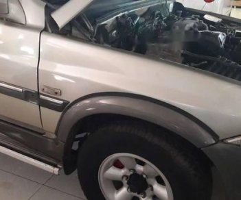 Ssangyong Musso 2004 - Cần bán xe Ssangyong Musso sản xuất 2004, màu ghi vàng 